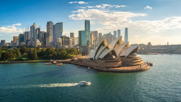 Offshore Development Center Australia concept illustrated with Sydney skyline and Opera House waterfront view
